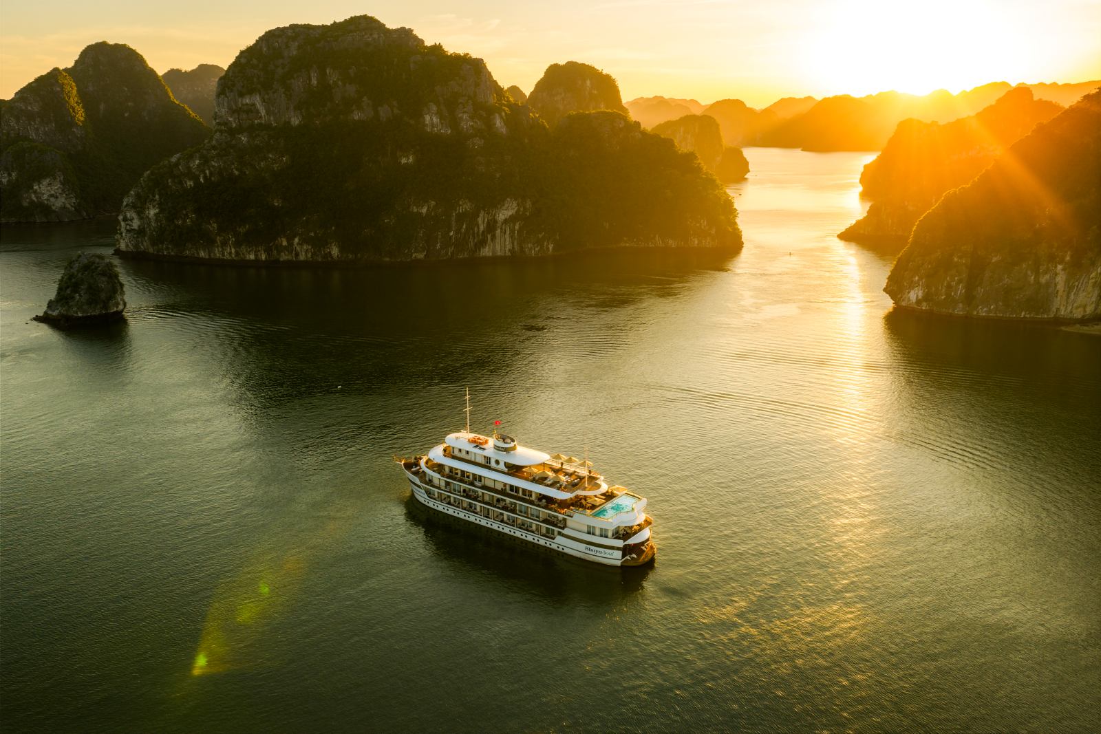 Sunset cruise among the limestone islands of Hạ Long Bay, Vietnam