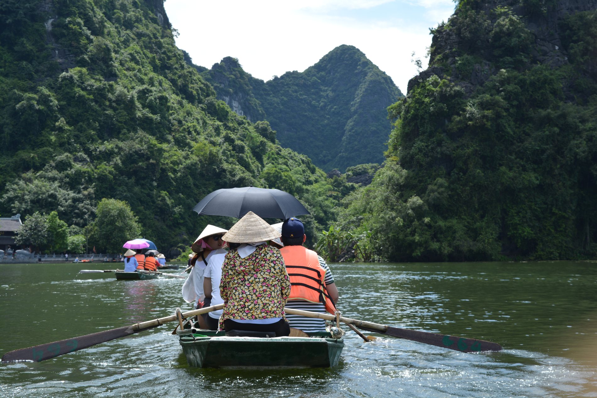 Small boats travelling through Trang An, Ninh Binh